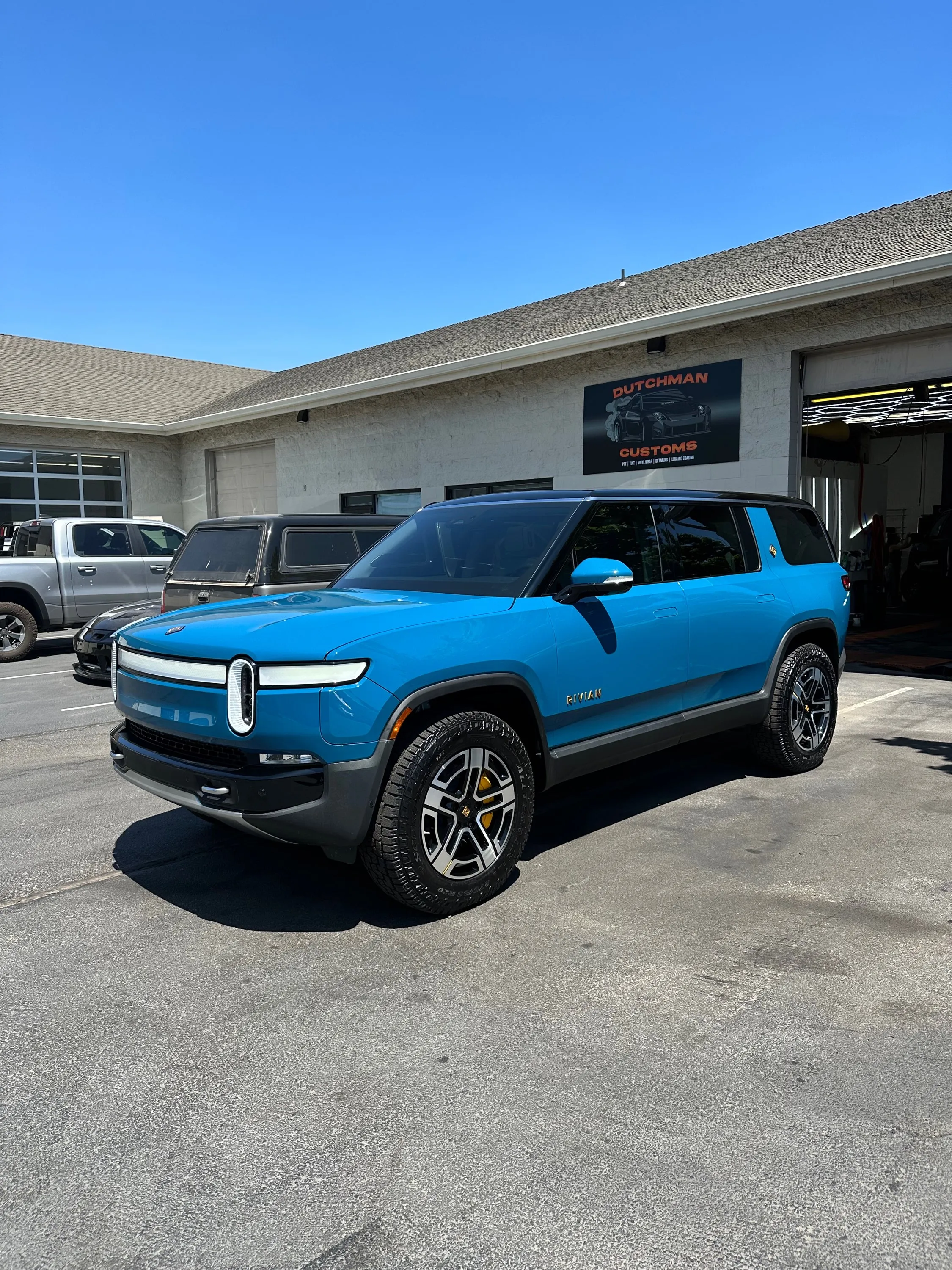 Blue Rivian R1S at the shop